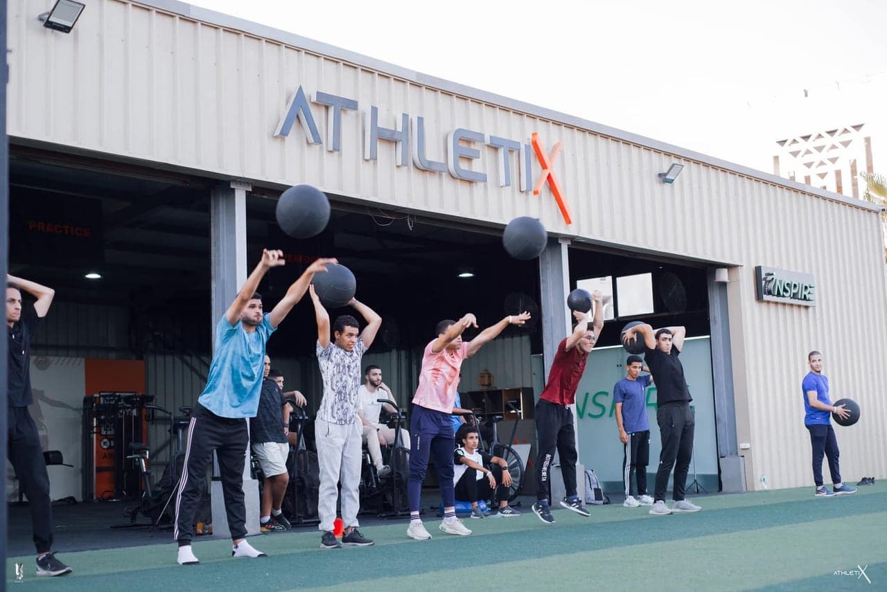 An athlete completing a medicine-ball power drill.