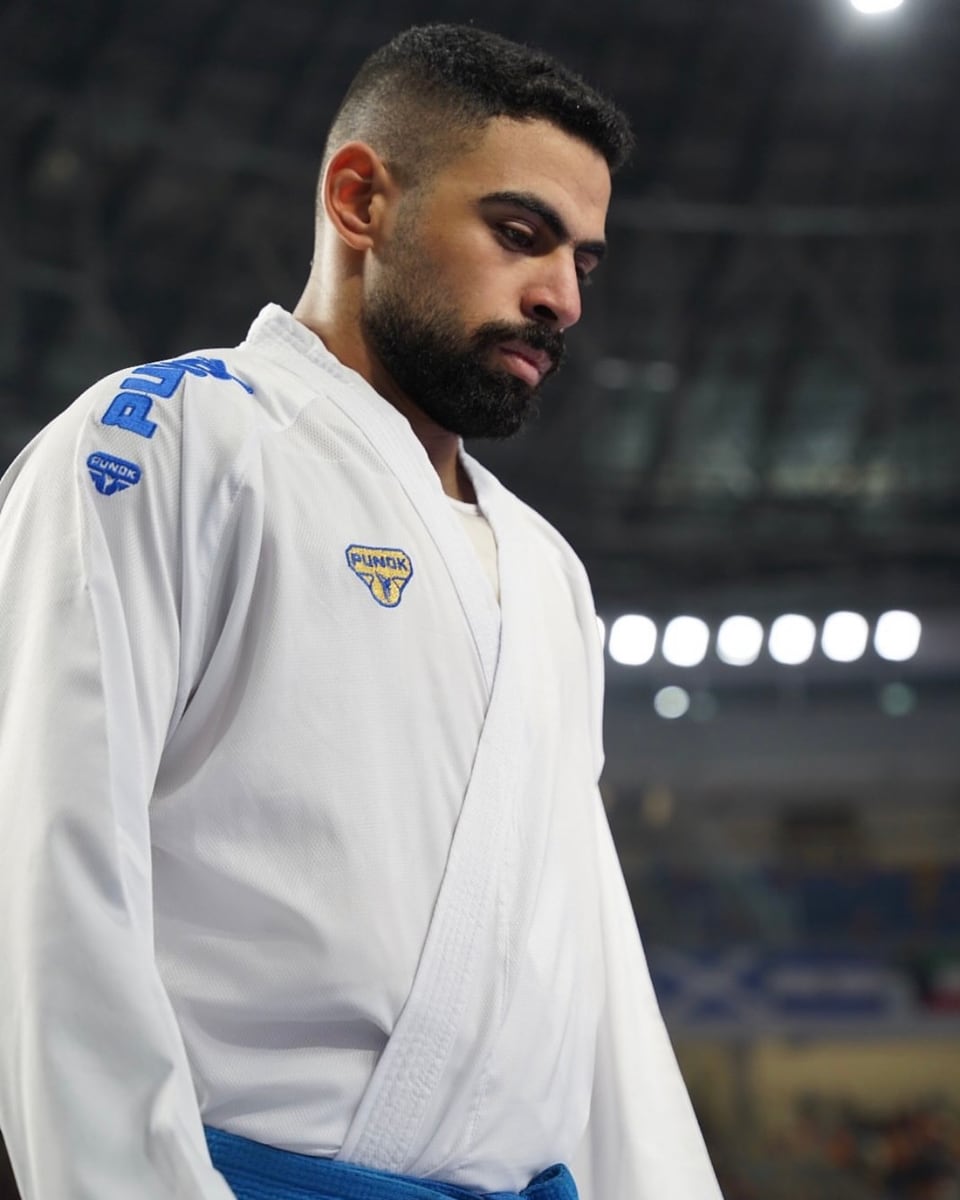 Taha Tarek waiting on the competition floor before a bout.